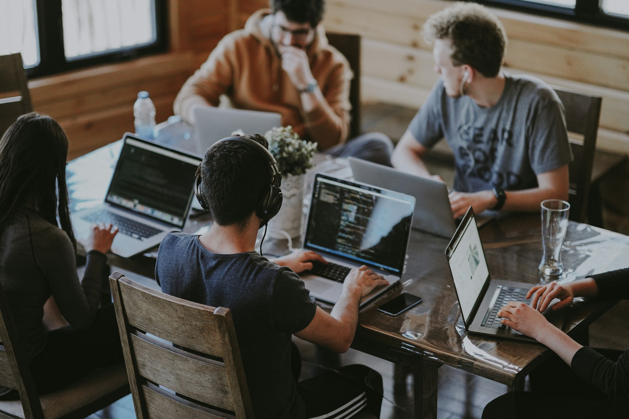 People using laptops representing AI-powered home design tools