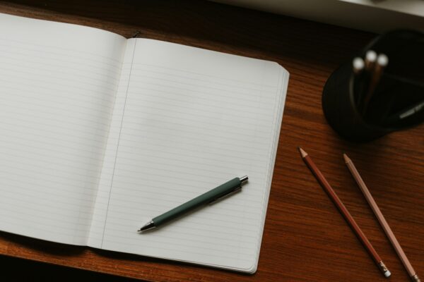 Open notebook and pen for planning a DIY home budget