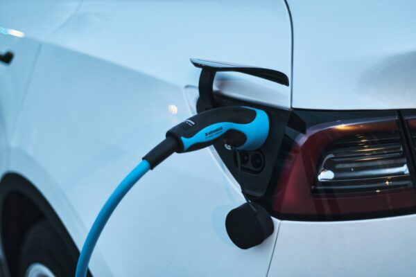 Electric car charging representing eco-friendly vehicle upgrades