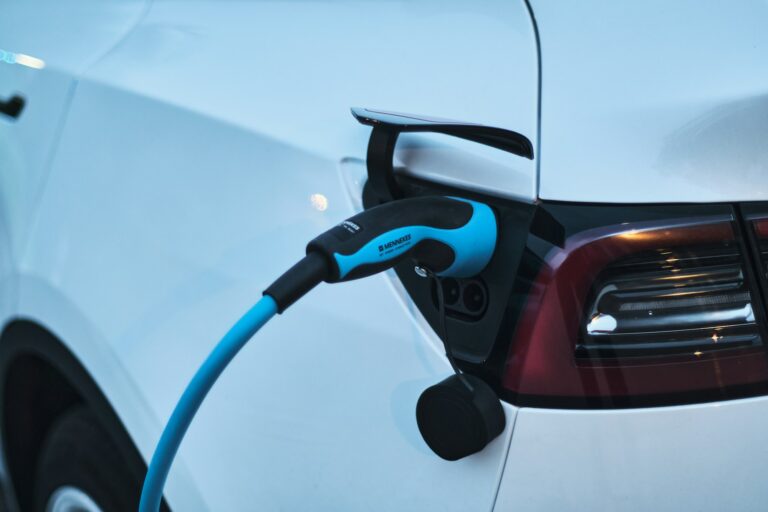 Electric car charging representing eco-friendly vehicle upgrades