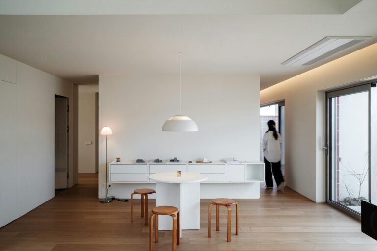 Modern minimalist living room with white furniture