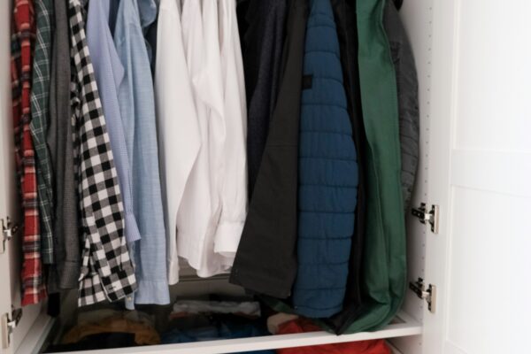 Organized closet with tidy wardrobe representing a minimalist wardrobe